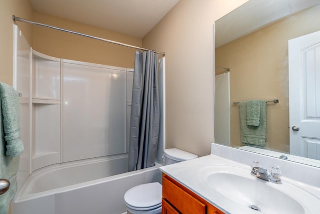 full bathroom featuring vanity, toilet, and shower / tub combo with curtain