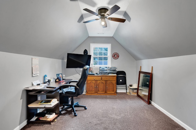 carpeted home office with lofted ceiling and ceiling fan