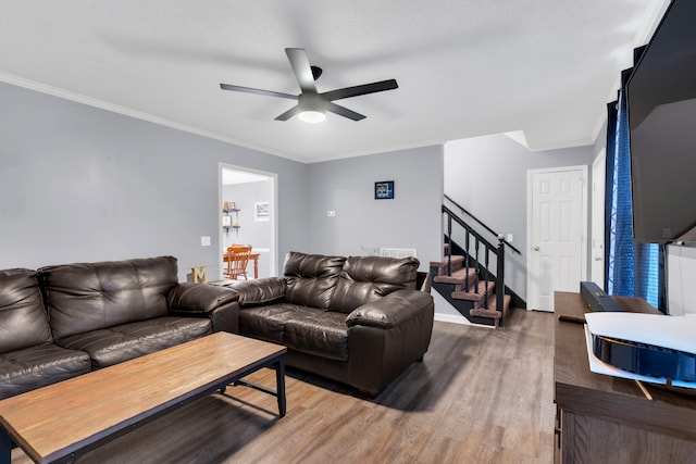 living room featuring ceiling fan, crown molding, and hardwood / wood-style floors