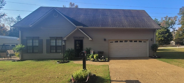 47 Hickory Ln, Sugar Tree, TN 38380 - view of front facade with a front lawn, concrete driveway, and a shingled roof
