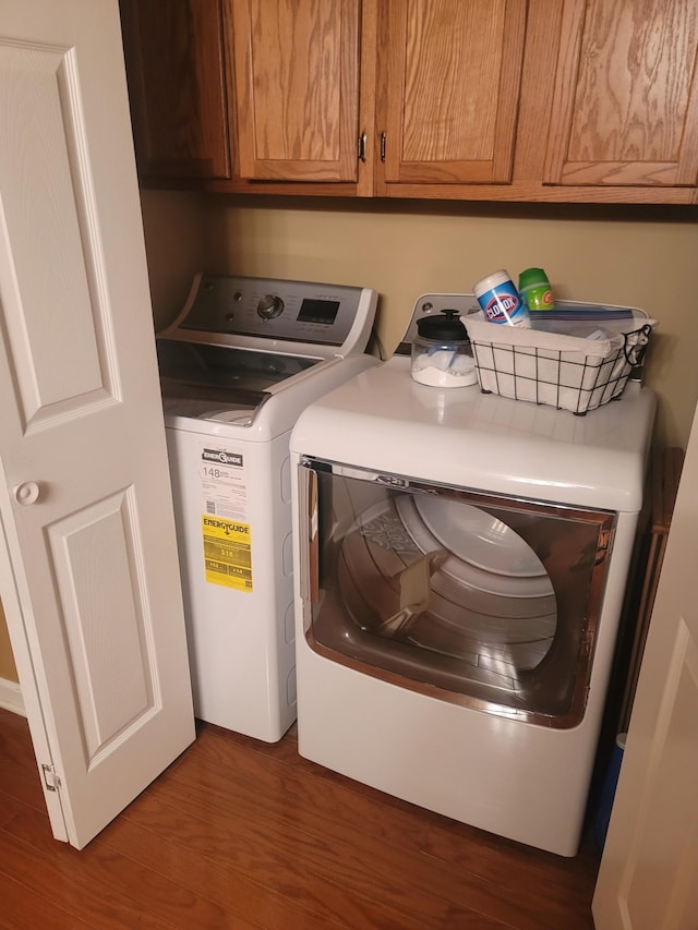 47 Hickory Ln, Sugar Tree, TN 38380 - laundry room featuring cabinet space, washer and dryer, and wood finished floors
