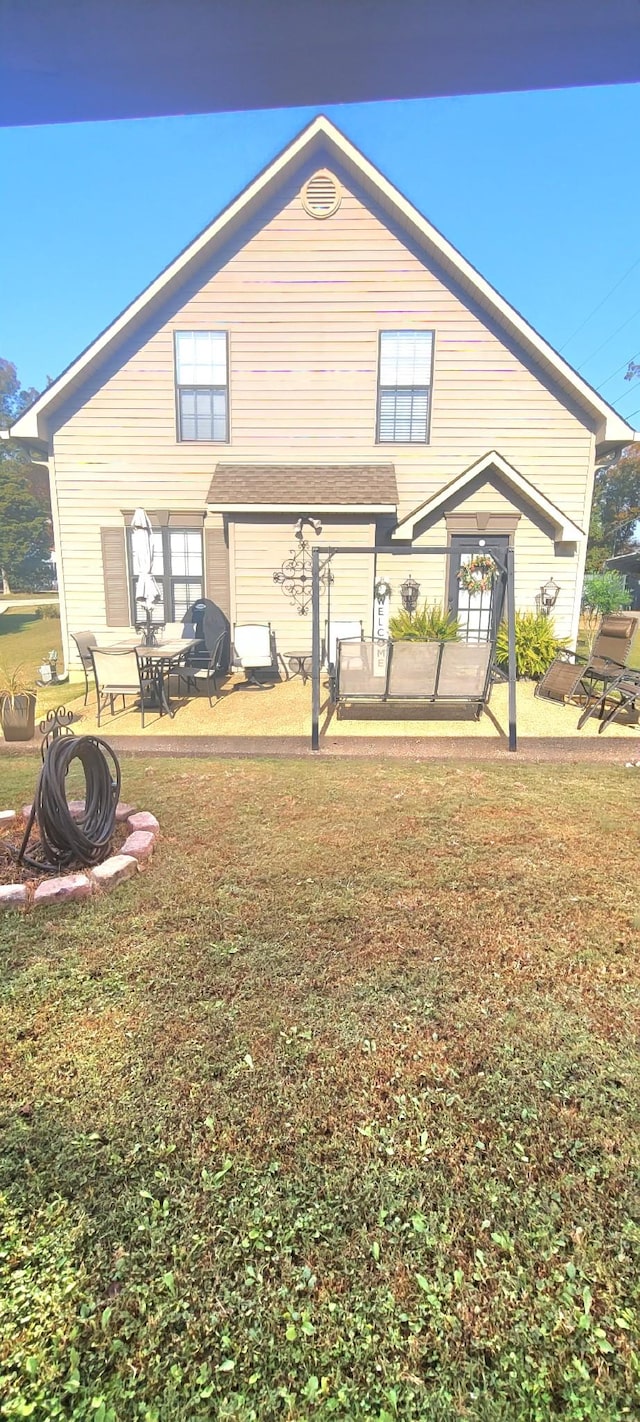 47 Hickory Ln, Sugar Tree, TN 38380 - rear view of house featuring a lawn and a patio area