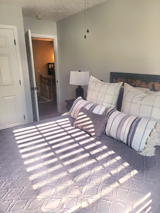 47 Hickory Ln, Sugar Tree, TN 38380 - bedroom with a textured ceiling