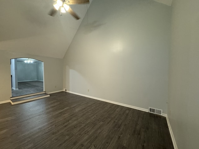 additional living space with dark hardwood / wood-style floors, ceiling fan, and vaulted ceiling