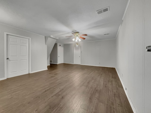 bonus room with a textured ceiling, dark hardwood / wood-style floors, and ceiling fan