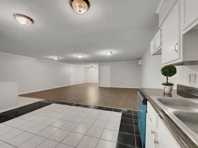 kitchen with wood-type flooring, white cabinetry, a textured ceiling, sink, and dishwasher