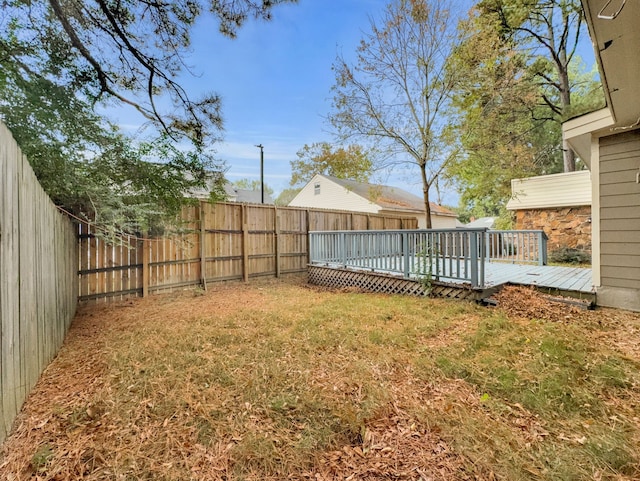 view of yard with a wooden deck