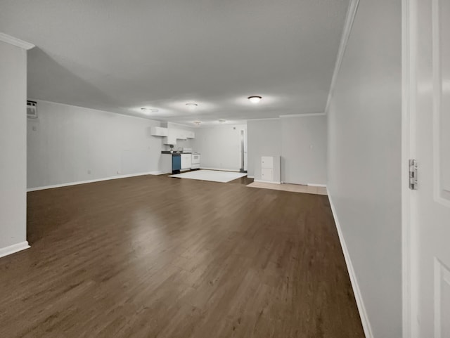 unfurnished living room with dark hardwood / wood-style flooring and crown molding