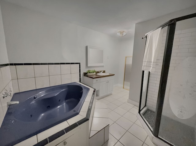 bathroom with vanity, tile patterned floors, and separate shower and tub