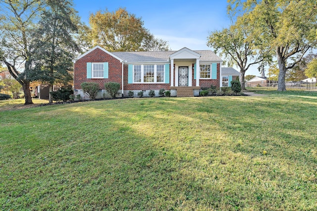 single story home featuring a front lawn