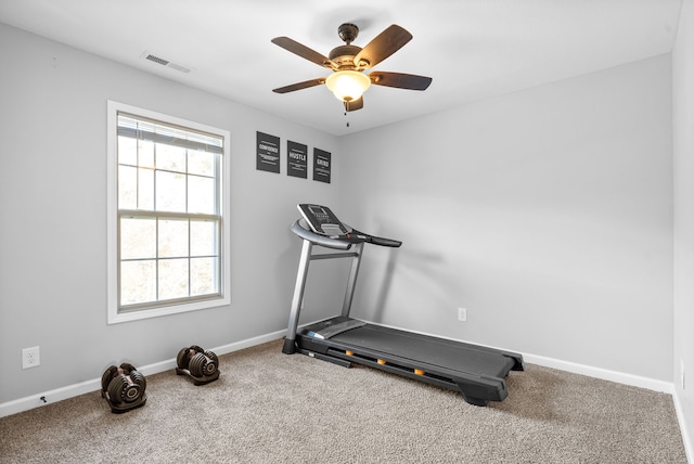 workout room featuring ceiling fan and carpet floors