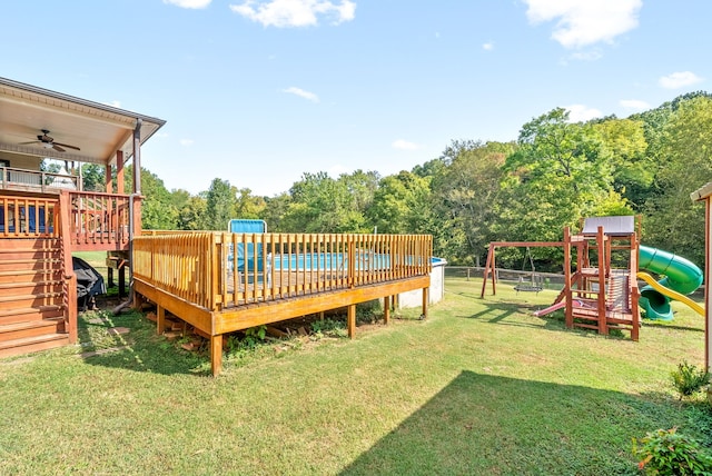 exterior space featuring a pool, a yard, and a playground