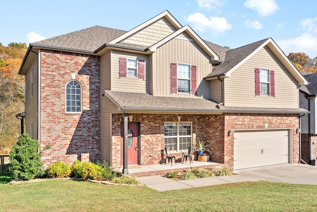 view of front of home with a garage and a front lawn