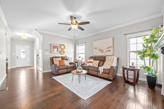 living room featuring crown molding, dark hardwood / wood-style floors, and ceiling fan