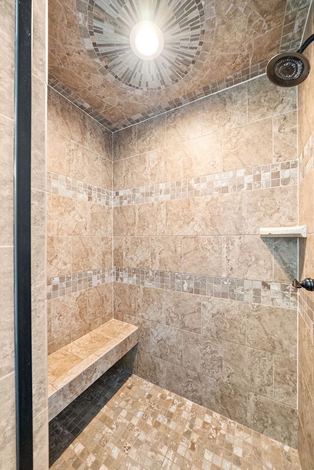 bathroom with a tile shower