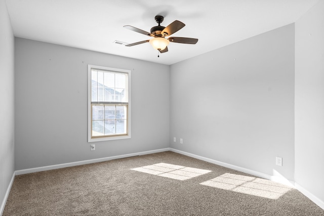 unfurnished room with carpet flooring and ceiling fan