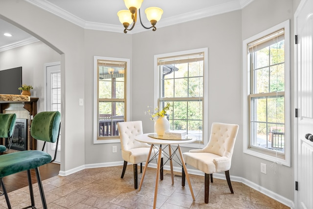 dining room featuring ornamental molding and an inviting chandelier