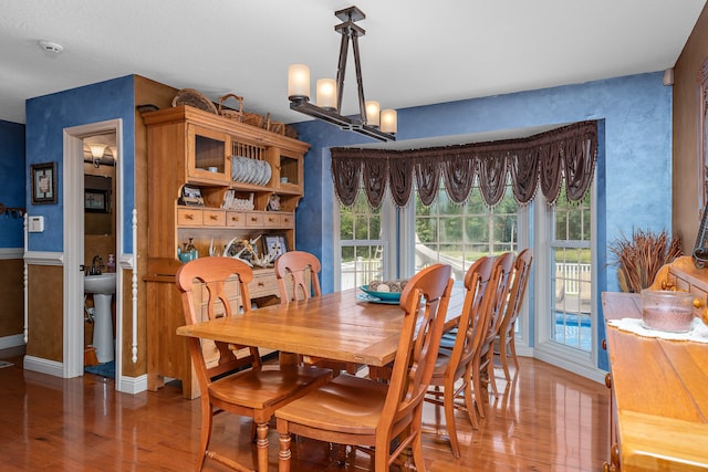 dining room featuring a notable chandelier and wood-type flooring