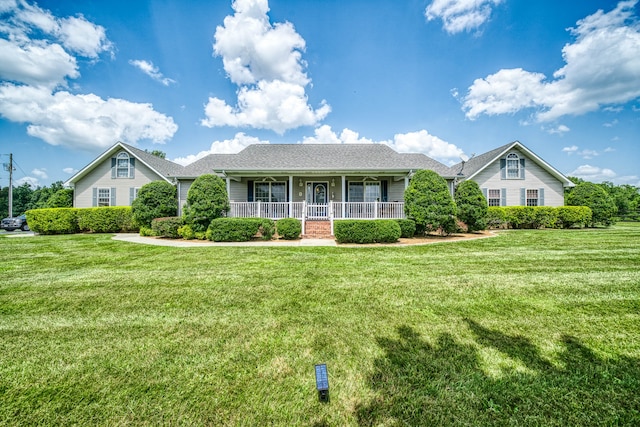 ranch-style home with a porch and a front lawn