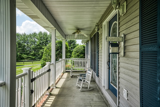 deck with covered porch and ceiling fan