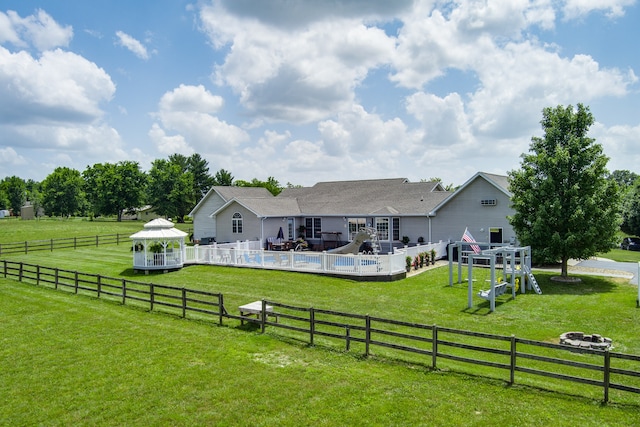 view of yard with a rural view, a gazebo, a patio area, and a fenced in pool