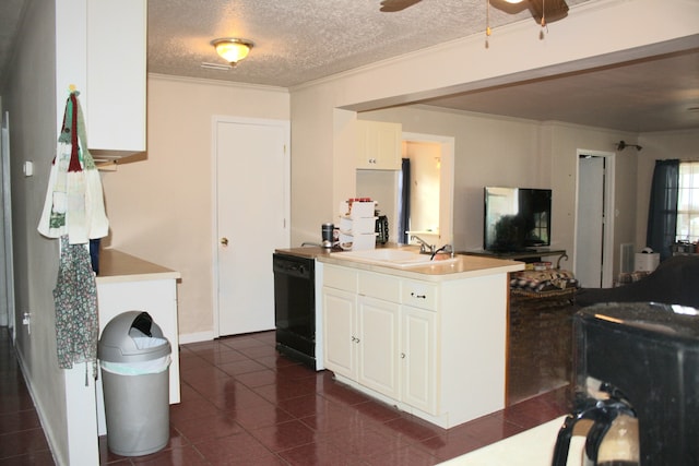 kitchen featuring white cabinets, black dishwasher, sink, and a textured ceiling