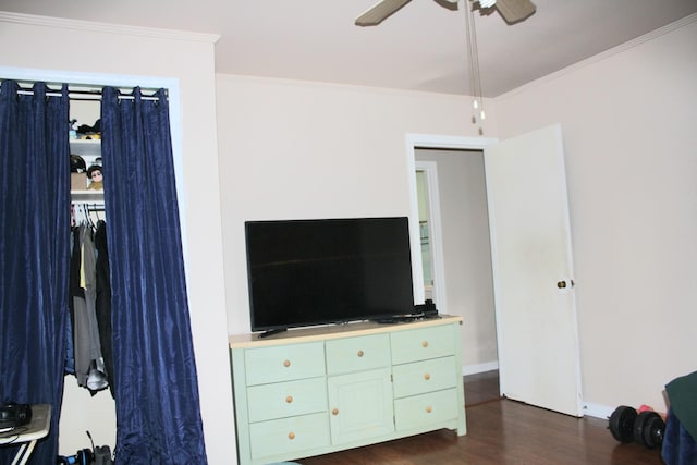 bedroom with baseboards, ornamental molding, dark wood-style flooring, and ceiling fan