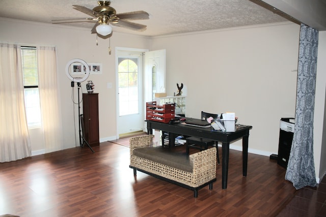 home office with ceiling fan, crown molding, a textured ceiling, and dark hardwood / wood-style floors