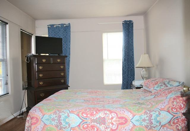 bedroom featuring wood finished floors
