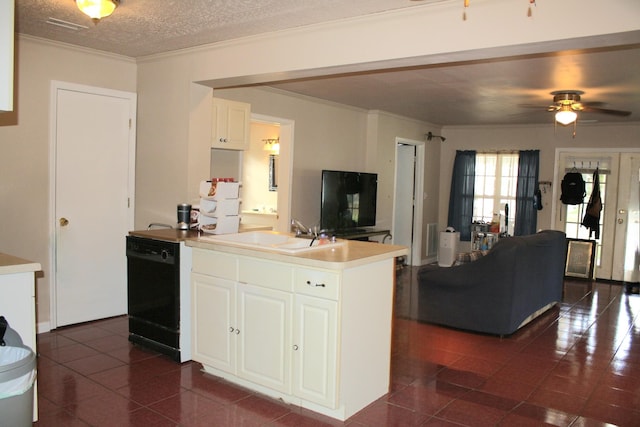 kitchen with dark tile patterned floors, a sink, black dishwasher, and open floor plan