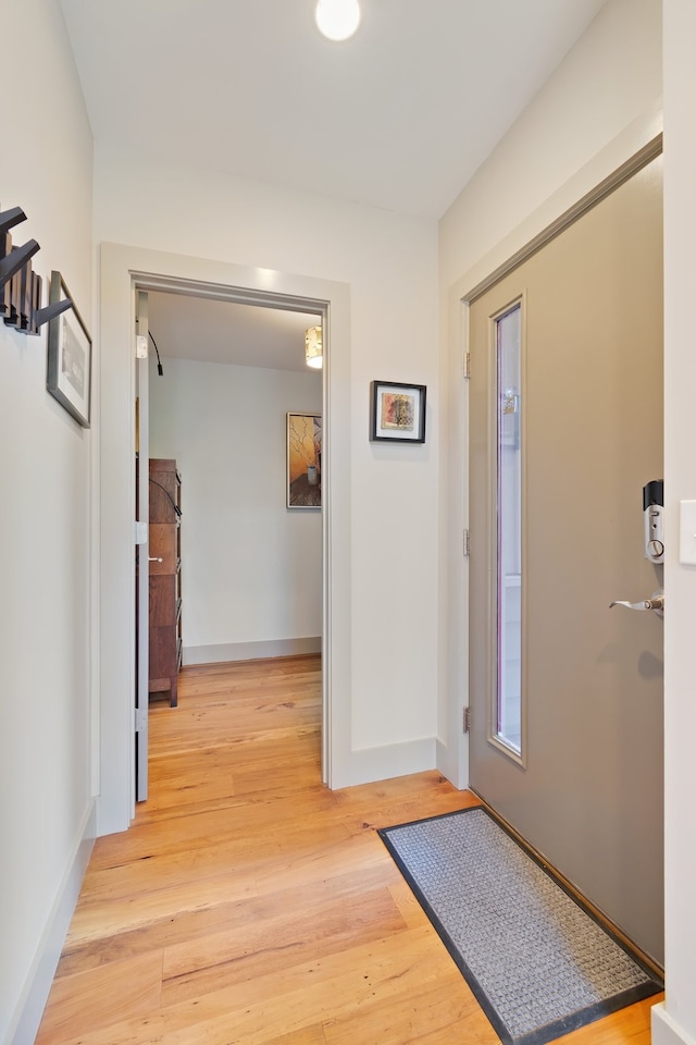 foyer with light wood-type flooring