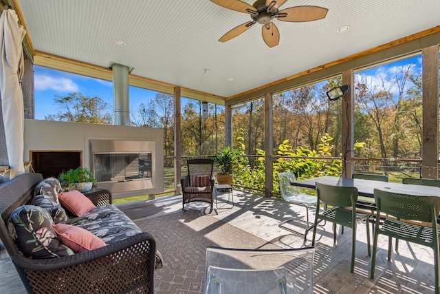 sunroom / solarium with ceiling fan