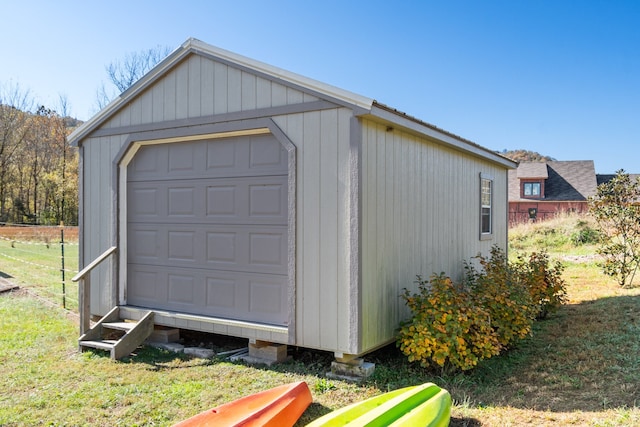 garage featuring a lawn