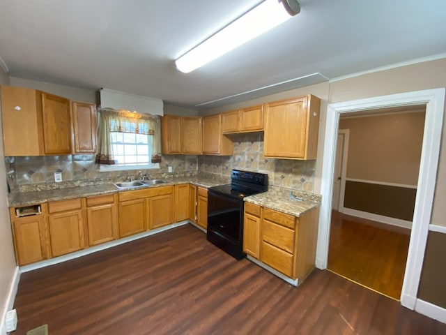 kitchen with black range with electric cooktop, light stone countertops, sink, backsplash, and dark hardwood / wood-style flooring