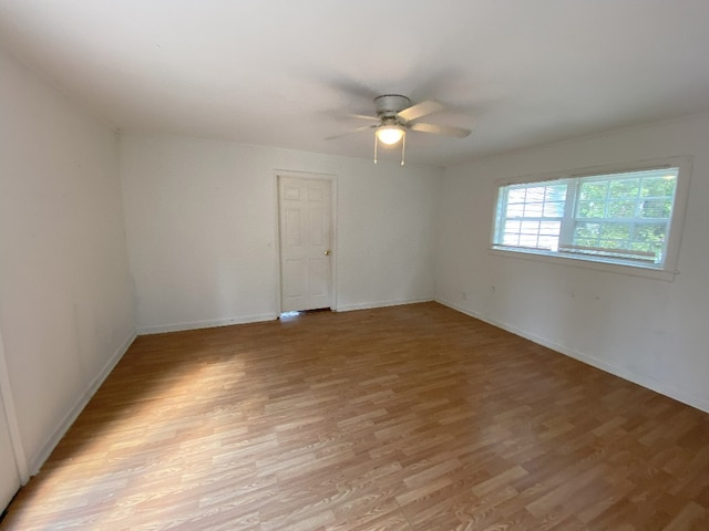 unfurnished room with light hardwood / wood-style floors and ceiling fan