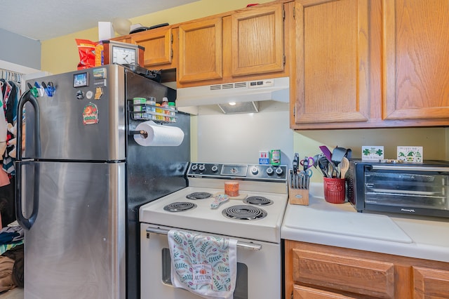 kitchen featuring white electric range oven and stainless steel fridge