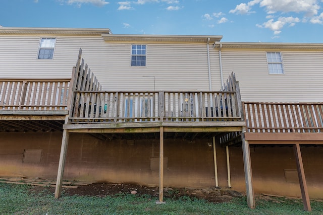 back of house featuring a wooden deck