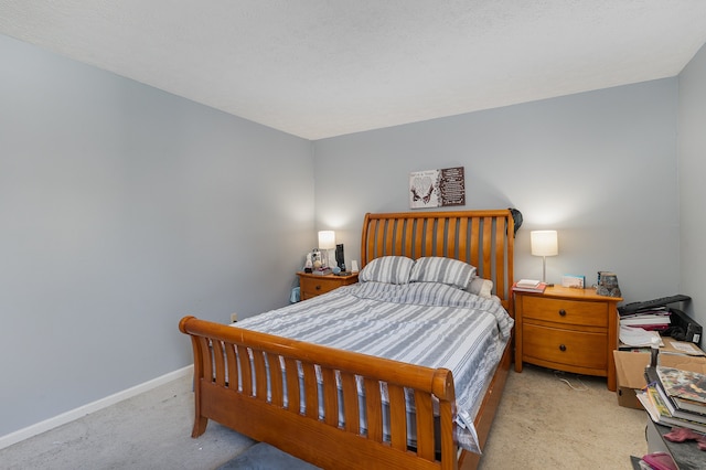 carpeted bedroom with a textured ceiling