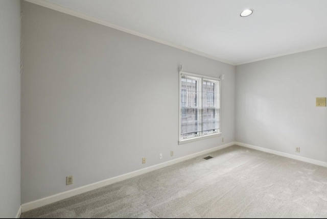 carpeted empty room with ornamental molding