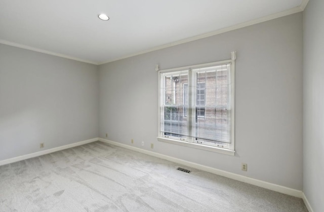 unfurnished room with carpet floors and ornamental molding