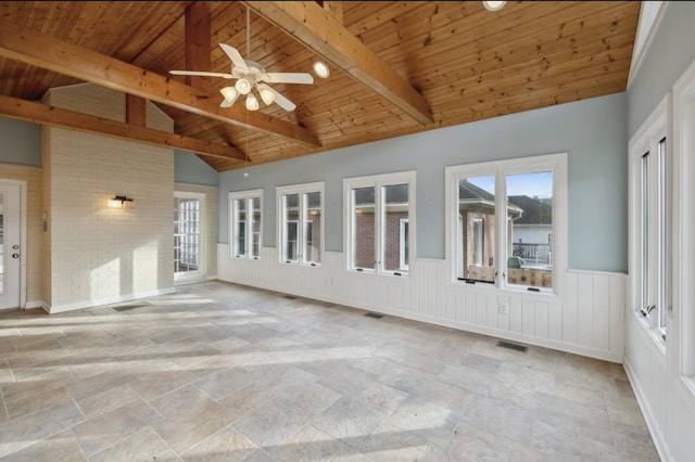 unfurnished sunroom featuring vaulted ceiling with beams, ceiling fan, and wooden ceiling