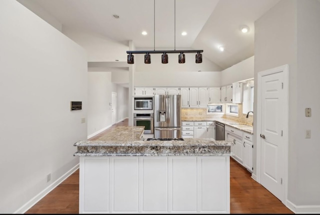 kitchen featuring dark hardwood / wood-style flooring, high vaulted ceiling, stainless steel appliances, and white cabinetry