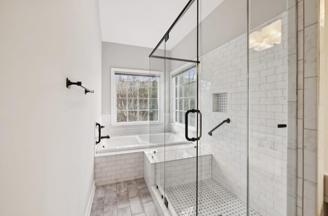 bathroom with wood-type flooring and independent shower and bath