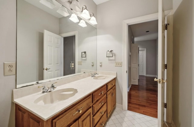 bathroom with tile patterned flooring and vanity