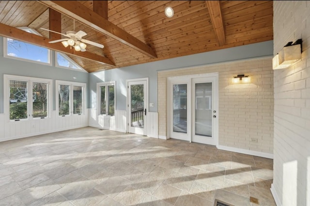 unfurnished sunroom featuring vaulted ceiling with beams, ceiling fan, and wood ceiling