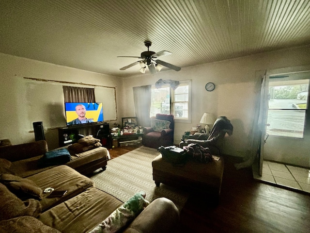 living room featuring hardwood / wood-style floors and ceiling fan