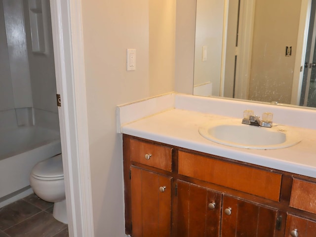 bathroom featuring vanity, toilet, and tile patterned floors