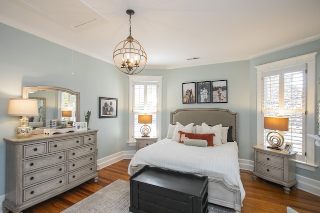 bedroom featuring multiple windows, dark hardwood / wood-style floors, ornamental molding, and an inviting chandelier