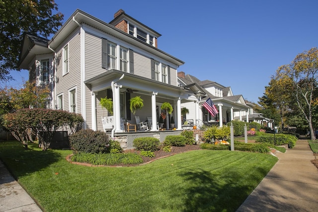 view of front of house featuring a front lawn and a porch