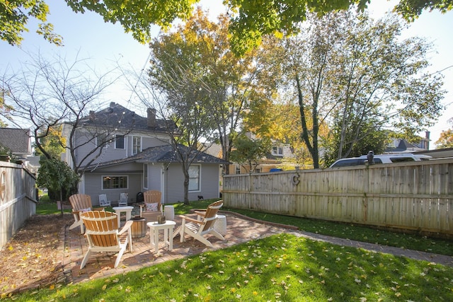 view of yard with a patio area and an outdoor fire pit